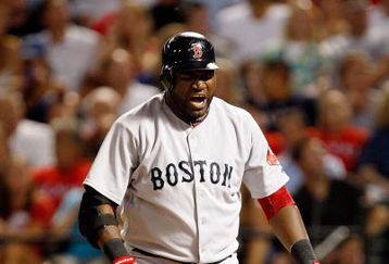ARLINGTON, TX - JULY 22:  Designated hitter David Ortiz #34 of the Boston Red Sox reacts after hitting a foul ball against the Texas Rangers on July 22, 2009 at Rangers Ballpark in Arlington, Texas.  (Photo by Ronald Martinez/Getty Images)