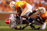 KNOXVILLE, TN - SEPTEMBER 20:  Emmanuel Moody #21 of the Florida Gators is tackled by teammates DeAngelo Willingham #24 and Eric Berry #14 of the Tennessee Volunteers during their game at Neyland Stadium on September 20, 2008 in Knoxville, Tennessee.  (Photo by Streeter Lecka/Getty Images)