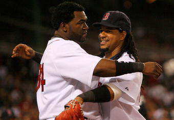BOSTON - JULY 27: David Ortiz #34 and Manny Ramirez #24 of the Boston Red Sox embrace during a game with the New York Yankees at Fenway Park on July 27, 2008 in Boston, Massachusetts.  (Photo by Jim Rogash/Getty Images)