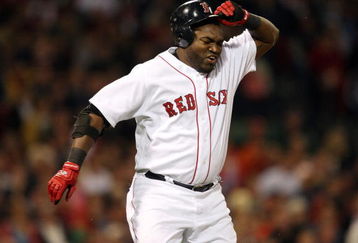 BOSTON - JULY 07:  David Ortiz #34 of the Boston Red Sox reacts after he flew out against the Oakland Athletics on July 7, 2009 at Fenway Park in Boston, Massachusetts.  (Photo by Elsa/Getty Images)