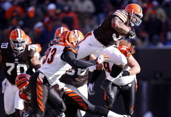 CLEVELAND - DECEMBER 21: Jamal Lewis #31 of the Cleveland Browns jumps over Chinedum Ndukwe #41 of the Cincinnati Bengals for a first quarter first down at Cleveland Browns Stadium December 21, 2008 in Cleveland, Ohio.  (Photo by Gregory Shamus/Getty Images)
