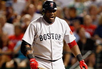 ARLINGTON, TX - JULY 22:  Designated hitter David Ortiz #34 of the Boston Red Sox reacts after hitting a foul ball against the Texas Rangers on July 22, 2009 at Rangers Ballpark in Arlington, Texas.  (Photo by Ronald Martinez/Getty Images)
