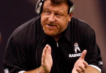NEW ORLEANS - OCTOBER 12:  Interim Head coach Tom Cable talks with an assistant coach during the game against the New Orleans Saints of the Oakland Raiders on October 12, 2008 at the Superdome in New Orleans, Louisiana.  The Saints defeated the Raiders 34-3.  (Photo by Chris Graythen/Getty Images)