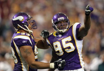 MINNEAPOLIS, MN - OCTOBER 28: Kenechi Udeze #95 of the Minnesota Vikings celebrates with Kevin Williams #93 during the game against the Philadelphia Eagles at the Hubert H. Humphrey Metrodome on October 28, 2007 in Minneapolis, Minnesota. The Eagles won 23-16. (Photo by Harry How/Getty Images)