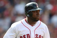 BOSTON - JULY 30:  Designated hitter David Ortiz #34 of the Boston Red Sox hits a three-run home run against the Oakland A's in the seventh inning to give the Red Sox a 6-5 lead on July 30, 2009 at Fenway Park in Boston, Massachusetts.  (Photo by Elsa/Getty Images)