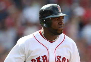 BOSTON - JULY 30:  Designated hitter David Ortiz #34 of the Boston Red Sox hits a three-run home run against the Oakland A's in the seventh inning to give the Red Sox a 6-5 lead on July 30, 2009 at Fenway Park in Boston, Massachusetts.  (Photo by Elsa/Getty Images)