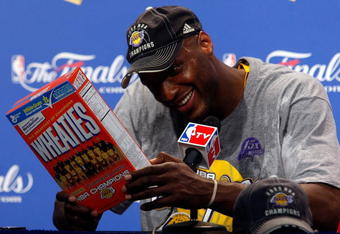 ORLANDO, FL - JUNE 14:  Lamar Odom #7 of the Los Angeles Lakers looks at the Wheaties box during the post game news conference after the Lakers defeated the Orlando Magic 99-86 to win the NBA Championship in Game Five of the 2009 NBA Finals on June 14, 2009 at Amway Arena in Orlando, Florida.  NOTE TO USER:  User expressly acknowledges and agrees that, by downloading and or using this photograph, User is consenting to the terms and conditions of the Getty Images License Agreement.  (Photo by Chris Graythen/Getty Images)