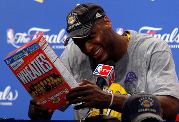 ORLANDO, FL - JUNE 14:  Lamar Odom #7 of the Los Angeles Lakers looks at the Wheaties box during the post game news conference after the Lakers defeated the Orlando Magic 99-86 to win the NBA Championship in Game Five of the 2009 NBA Finals on June 14, 2009 at Amway Arena in Orlando, Florida.  NOTE TO USER:  User expressly acknowledges and agrees that, by downloading and or using this photograph, User is consenting to the terms and conditions of the Getty Images License Agreement.  (Photo by Chris Graythen/Getty Images)