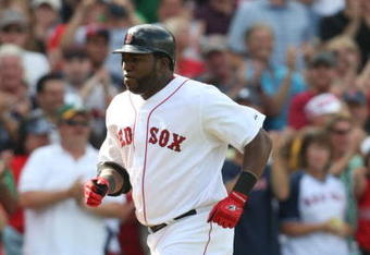 BOSTON - JULY 30:  Designated hitter David Ortiz #34 of the Boston Red Sox jogs to home plate after hitting a three-run home run against the Oakland A's in the seventh inning to give the Red Sox a 6-5 lead on July 30, 2009 at Fenway Park in Boston, Massachusetts.  (Photo by Elsa/Getty Images)