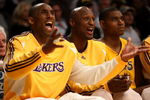 LOS ANGELES, CA - MAY 12:  (L-R) Kobe Bryant #24, Lamar Odom #7 and Andrew Bynum #17 of the Los Angeles Lakers sit on the bench late in the fourth quarter against the Houston Rockets in Game Five of the Western Conference Semifinals during the 2009 NBA Playoffs at Staples Center on May 12, 2009 in Los Angeles, California. NOTE TO USER: User expressly acknowledges and agrees that, by downloading and or using this photograph, User is consenting to the terms and conditions of the Getty Images License Agreement.  (Photo by Stephen Dunn/Getty Images)