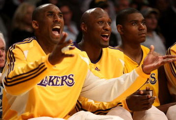 LOS ANGELES, CA - MAY 12:  (L-R) Kobe Bryant #24, Lamar Odom #7 and Andrew Bynum #17 of the Los Angeles Lakers sit on the bench late in the fourth quarter against the Houston Rockets in Game Five of the Western Conference Semifinals during the 2009 NBA Playoffs at Staples Center on May 12, 2009 in Los Angeles, California. NOTE TO USER: User expressly acknowledges and agrees that, by downloading and or using this photograph, User is consenting to the terms and conditions of the Getty Images License Agreement.  (Photo by Stephen Dunn/Getty Images)