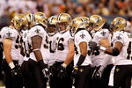 NEW ORLEANS - OCTOBER 12:  Members of the New Orleans Saints defense huddle together during their NFL game against the Oakland Raiders on October 12, 2008 at the Superdome in New Orleans, Louisiana. The Saints defeated the Raiders 34-3.  (Photo by Chris Graythen/Getty Images)