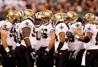 NEW ORLEANS - OCTOBER 12:  Members of the New Orleans Saints defense huddle together during their NFL game against the Oakland Raiders on October 12, 2008 at the Superdome in New Orleans, Louisiana. The Saints defeated the Raiders 34-3.  (Photo by Chris Graythen/Getty Images)