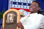 COOPERSTOWN, NY - JULY 26:  2009 inductee Rickey Henderson holds his plaque after his induction into the Baseball Hall of Fame at Clark Sports Center during the Baseball Hall of Fame induction ceremony on July 26, 2009 in Cooperstown, New York. Henderson is the all-time leader in stolen bases (1,406) and runs (2,295), a ten time All-Star, was the 1990 American League most valuable player and won two World Series titles.  (Photo by Jim McIsaac/Getty Images)