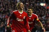 LIVERPOOL, UNITED KINGDOM - APRIL 08:  Fernando Torres of Liverpool celebrates scoring the opening goal with team mate Steven Gerrard (R) during the UEFA Champions League Quarter Final First Leg match between Liverpool and Chelsea at Anfield on April 8, 2009 in Liverpool, England. (Photo by Clive Rose/Getty Images)