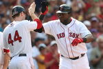 BOSTON - JULY 30:  Designated hitter David Ortiz #34 of the Boston Red Sox high fives teammate Jason Bay #44 after hitting a three-run home run against the Oakland A's in the seventh inning to give the Red Sox a 6-5 lead on July 30, 2009 at Fenway Park in Boston, Massachusetts.  (Photo by Elsa/Getty Images)