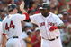 BOSTON - JULY 30:  Designated hitter David Ortiz #34 of the Boston Red Sox high fives teammate Jason Bay #44 after hitting a three-run home run against the Oakland A's in the seventh inning to give the Red Sox a 6-5 lead on July 30, 2009 at Fenway Park in Boston, Massachusetts.  (Photo by Elsa/Getty Images)