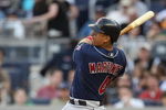NEW YORK - APRIL 18:  Victor Martinez #41 of the Cleveland Indians hits a solo home run against the New York Yankees at Yankee Stadium on April 18, 2009 in the Bronx borough of New York City.  (Photo by Nick Laham/Getty Images)