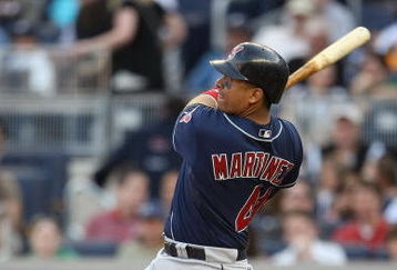 NEW YORK - APRIL 18:  Victor Martinez #41 of the Cleveland Indians hits a solo home run against the New York Yankees at Yankee Stadium on April 18, 2009 in the Bronx borough of New York City.  (Photo by Nick Laham/Getty Images)