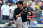 NEW YORK - MAY 09:  John Grabow #34 of the Pittsburgh Pirates pitches against the New York Mets on May 9, 2009 at Citi Field in the Flushing neighborhood of the Queens borough of New York City. The Mets defeated the Pirates 10-1.  (Photo by Jim McIsaac/Getty Images)
