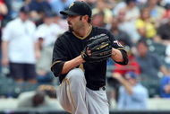 NEW YORK - MAY 09: John Grabow #34 of the Pittsburgh Pirates pitches against the New York Mets on May 9, 2009 at Citi Field in the Flushing neighborhood of the Queens borough of New York City. The Mets defeated the Pirates 10-1. (Photo by Jim McIsaac/Getty Images)