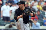 NEW YORK - MAY 09:  John Grabow #34 of the Pittsburgh Pirates pitches against the New York Mets on May 9, 2009 at Citi Field in the Flushing neighborhood of the Queens borough of New York City. The Mets defeated the Pirates 10-1.  (Photo by Jim McIsaac/Getty Images)