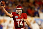 MIAMI - JANUARY 08:  Sam  Bradford #14 of the Oklahoma Sooners throws a passagainst the Florida Gators during the FedEx BCS National Championship game at Dolphin Stadium on January 8, 2009 in Miami, Florida.  (Photo by Marc Serota/Getty Images)