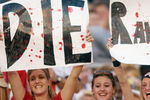 SAN DIEGO - JANUARY 26:  Three female fans of the Tampa Bay Buccaneers show their hate for the Oakland Raiders during Super Bowl XXXVII on January 26, 2003 at Qualcomm Stadium in San Diego, California. The Buccaneers defeated the Raiders 48-21. (Photo by Doug Pensinger/Getty Images)