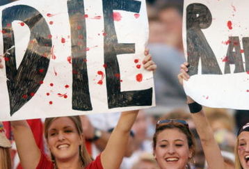 SAN DIEGO - JANUARY 26:  Three female fans of the Tampa Bay Buccaneers show their hate for the Oakland Raiders during Super Bowl XXXVII on January 26, 2003 at Qualcomm Stadium in San Diego, California. The Buccaneers defeated the Raiders 48-21. (Photo by Doug Pensinger/Getty Images)