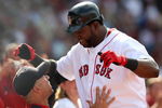 BOSTON - JULY 30:  Designated hitter David Ortiz #34 of the Boston Red Sox celebrates with manager Terry Francona #47 after hitting a three-run home run against the Oakland A's in the seventh inning to give the Red Sox a 6-5 lead on July 30, 2009 at Fenway Park in Boston, Massachusetts.  (Photo by Elsa/Getty Images)