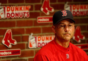 BOSTON - JULY 30:  Manager Terry Francona #47 of the Boston Red Sox reflects at a post game press conference after the game against the Oakland A's on July 30, 2009 at Fenway Park in Boston, Massachusetts. The Red Sox won 8-5.  (Photo by Elsa/Getty Images)