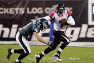 PHILADELPHIA - DECEMBER 31: Michael Vick #7 of the Atlanta Falcons runs the ball against Sean Considine #37 of the Philadelphia Eagles in NFL action December 31, 2006 at Lincoln Financial Field in Philadelphia, Pennsylvania.  (Photo by Jim McIsaac/Getty Images)