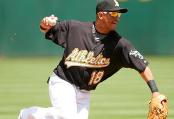 OAKLAND, CA - MAY 09:  Orlando Cabrera #18  of the Oakland Athletics throws to first base during their against the Toronto Blue Jays on May 9, 2009 at the Oakland Coliseum in Oakland, California.  (Photo by Ezra Shaw/Getty Images)