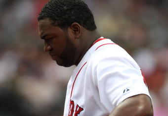 BOSTON - JULY 30:  Designated hitter David Ortiz #34 of the Boston Red Sox walks to the dugout against the Oakland A's on July 30, 2009 at Fenway Park in Boston, Massachusetts.  (Photo by Elsa/Getty Images)