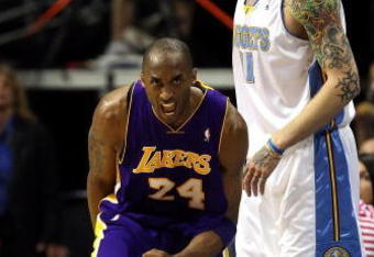 DENVER - MAY 29:  Kobe Bryant #24 of the Los Angeles Lakers reacts next to Chris Andersen #11 of the Denver Nuggets after Bryant makes a shot in the second quarter of Game Six of the Western Conference Finals during the 2009 NBA Playoffs at Pepsi Center on May 29, 2009 in Denver, Colorado. NOTE TO USER: User expressly acknowledges and agrees that, by downloading and or using this photograph, User is consenting to the terms and conditions of the Getty Images License Agreement.  (Photo by Jed Jacobsohn/Getty Images)