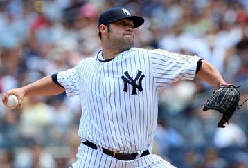 NEW YORK - JULY 19:  Joba Chamberlain #62 of the New York Yankees pitches against the Detroit Tigers on July 19, 2009 at Yankee Stadium in the Bronx borough of New York City.  (Photo by Jim McIsaac/Getty Images)