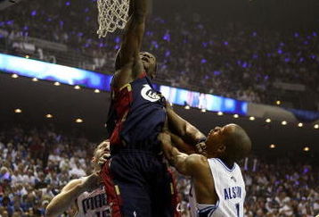 ORLANDO, FL - MAY 30: Ben Wallace #4 of the Cleveland Cavaliers drives to the hoop against Rafer Alston #1 and Hedo Turkoglu #15 of the Orlando Magic in Game Six of the Eastern Conference Finals during the 2009 Playoffs at Amway Arena on May 30, 2009 in Orlando, Florida. NOTE TO USER: User expressly acknowledges and agrees that, by downloading and or using this photograph, User is consenting to the terms and conditions of the Getty Images License Agreement  (Photo by Elsa/Getty Images)