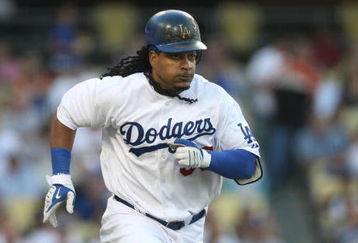 LOS ANGELES, CA - JULY 16:  Manny Ramirez #99 of the Los Angeles Dodgers runs to first base in the game against the Houston Astros on July 16, 2009 at Dodger Stadium in Los Angeles, California.  (Photo by Stephen Dunn/Getty Images)