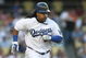 LOS ANGELES, CA - JULY 16:  Manny Ramirez #99 of the Los Angeles Dodgers runs to first base in the game against the Houston Astros on July 16, 2009 at Dodger Stadium in Los Angeles, California.  (Photo by Stephen Dunn/Getty Images)