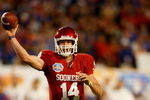 MIAMI - JANUARY 08:  Sam  Bradford #14 of the Oklahoma Sooners throws a passagainst the Florida Gators during the FedEx BCS National Championship game at Dolphin Stadium on January 8, 2009 in Miami, Florida.  (Photo by Marc Serota/Getty Images)