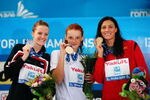 ROME - JULY 31:  Annamay Pierse of Canada (L) celebrates the silver medal, Nadja Higl of Serbia (C) the gold medal and Mirna Jukic of Austria the bronze medal during the medal ceremony for the Women's 200m Breaststroke Final during the 13th FINA World Championships at the Stadio del Nuoto on July 31, 2009 in Rome, Italy.  (Photo by Clive Rose/Getty Images)