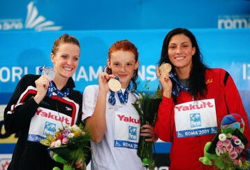 ROME - JULY 31:  Annamay Pierse of Canada (L) celebrates the silver medal, Nadja Higl of Serbia (C) the gold medal and Mirna Jukic of Austria the bronze medal during the medal ceremony for the Women's 200m Breaststroke Final during the 13th FINA World Championships at the Stadio del Nuoto on July 31, 2009 in Rome, Italy.  (Photo by Clive Rose/Getty Images)