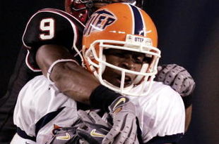 SAN DIEGO - AUGUST 31:  Wide receiver Johnnie Lee Higgins, Jr. #21 of the UTEP Miners catches the ball against the coverage of Defensive Back Terrell Maze during the first half of their NCAA Football Game at Qualcomm Stadium on August 31, 2006 in San Diego, California.  (Photo by Donald Miralle/Getty Images)