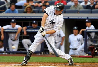 NEW YORK - JULY 20:  Mark Teixeira #25 of the New York Yankees connects for a first inning single against the Baltimore Orioles on July 20, 2009 at Yankee Stadium in the Bronx borough of New York City.  (Photo by Jim McIsaac/Getty Images)