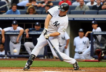 NEW YORK - JULY 20:  Mark Teixeira #25 of the New York Yankees connects for a first inning single against the Baltimore Orioles on July 20, 2009 at Yankee Stadium in the Bronx borough of New York City.  (Photo by Jim McIsaac/Getty Images)