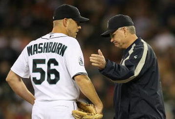 SEATTLE  - SEPTEMBER 16:  Starting pitcher Jarrod Washburn #56 of the Seattle Mariners is removed from the game in the fifth inning by manager John McLaren #8 against the Tampa Bay Devil Rays on September 16, 2007 at Safeco Field in Seattle, Washington. Catcher Jamie Burke #15 is at right. (Photo by Otto Greule Jr/Getty Images)