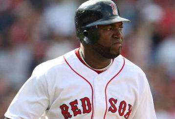 BOSTON - JULY 30:  Designated hitter David Ortiz #34 of the Boston Red Sox hits a three-run home run against the Oakland A's in the seventh inning to give the Red Sox a 6-5 lead on July 30, 2009 at Fenway Park in Boston, Massachusetts.  (Photo by Elsa/Getty Images)