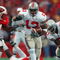 MADISON, WI - OCTOBER 19:  Running back Maurice Clarett #13 of the Ohio State Buckeyes runs with the ball during the Big Ten Conference football game against the Wisconsin Badgers at Camp Randall Stadium on October 19, 2002 in Madison, Wisconsin.  The Buckeyes won 19-14.  (Photo by Jonathan Daniel/Getty Images)