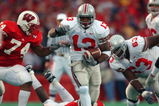 MADISON, WI - OCTOBER 19:  Running back Maurice Clarett #13 of the Ohio State Buckeyes runs with the ball during the Big Ten Conference football game against the Wisconsin Badgers at Camp Randall Stadium on October 19, 2002 in Madison, Wisconsin.  The Buckeyes won 19-14.  (Photo by Jonathan Daniel/Getty Images)