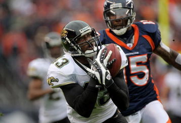 DENVER - OCTOBER 12:  Safety Gerald Sensabaugh #43 of the Jacksonville Jaguars makes an interception on a pass intended for wide receiver Brandon Marshall #15 of the Denver Broncos from Jay Cutler during NFL action on October 12, 2008 at Invesco Field at Mile High in Denver, Colorado.  (Photo by Doug Pensinger/Getty Images)